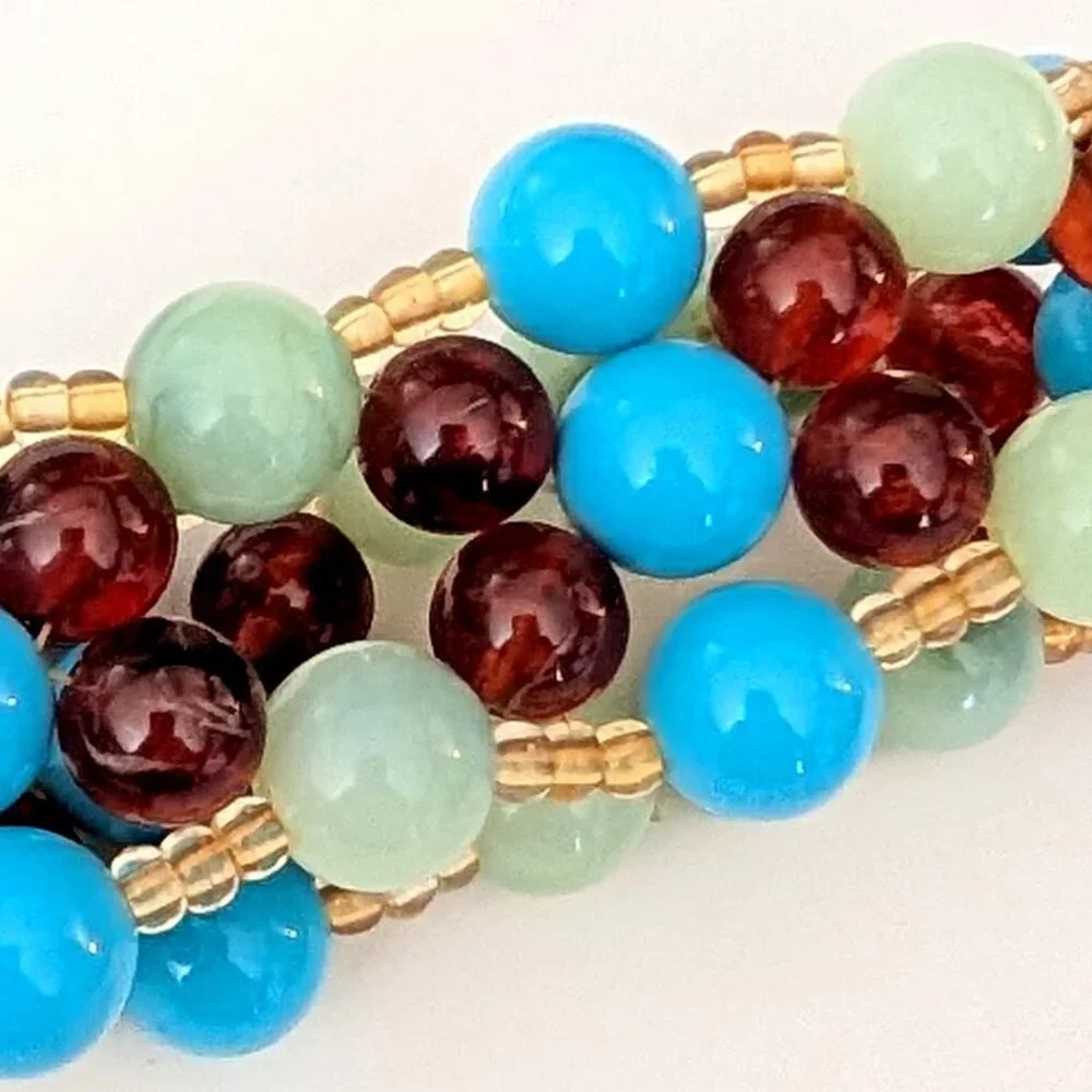 Blue, amber, green and pale yellow beaded stretch bracelet